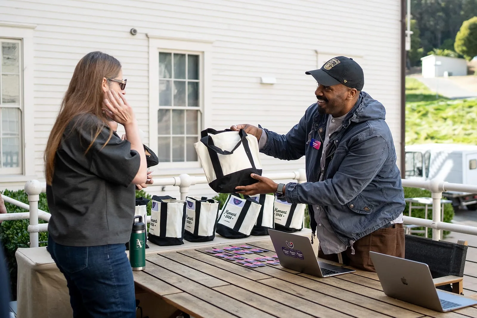 Guests picking up their arrival totes at check-in