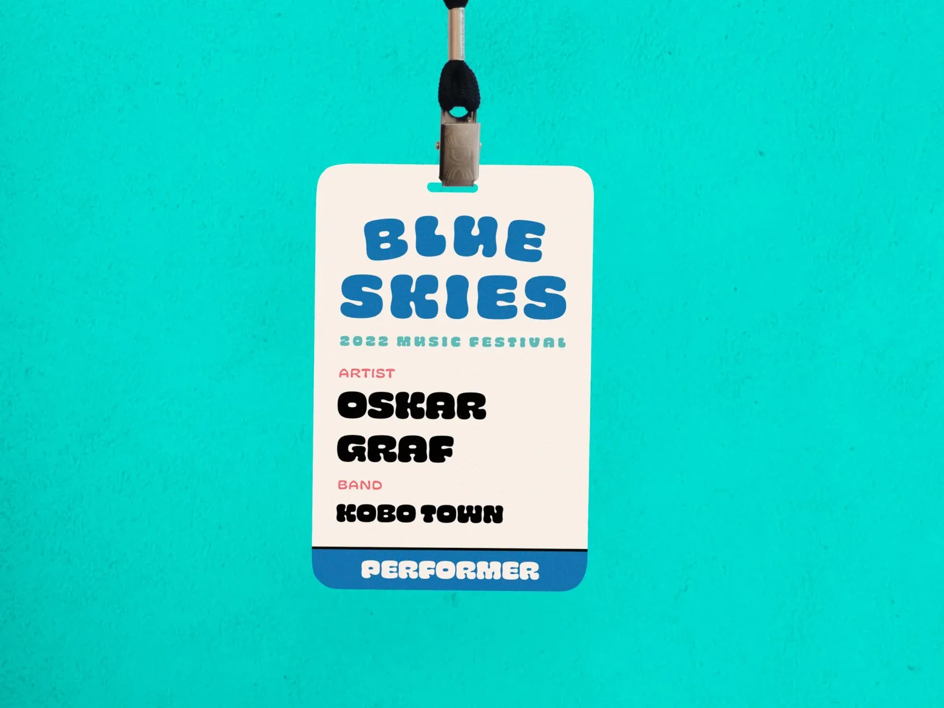 Blue Skies 2022 performer lanyard badge on a teal background