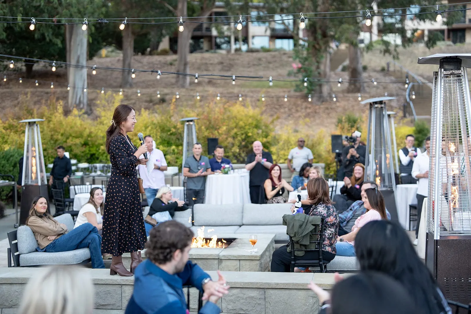 Welcome remarks around the fire pit at the evening reception