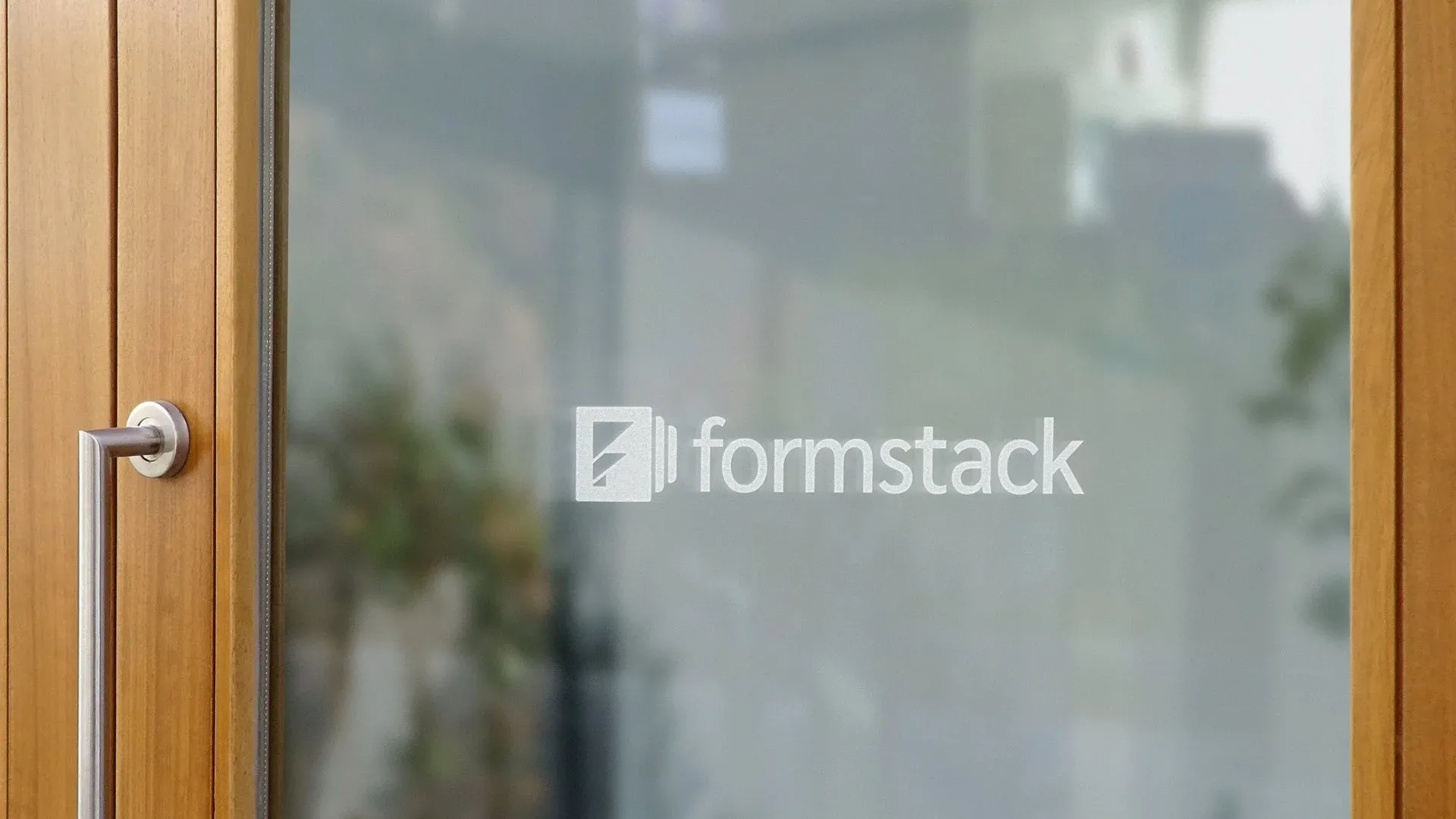 Formstack logo frosted on a glass office door
